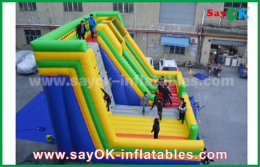Deslizador inflable para adultos 9.5*7.5*6.5m Deslizador inflable colorido con pared de escalada para parque de diversiones